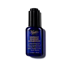 A 30ml bottle of Kiehl's Midnight Recovery Concentrate face oil against a white background.