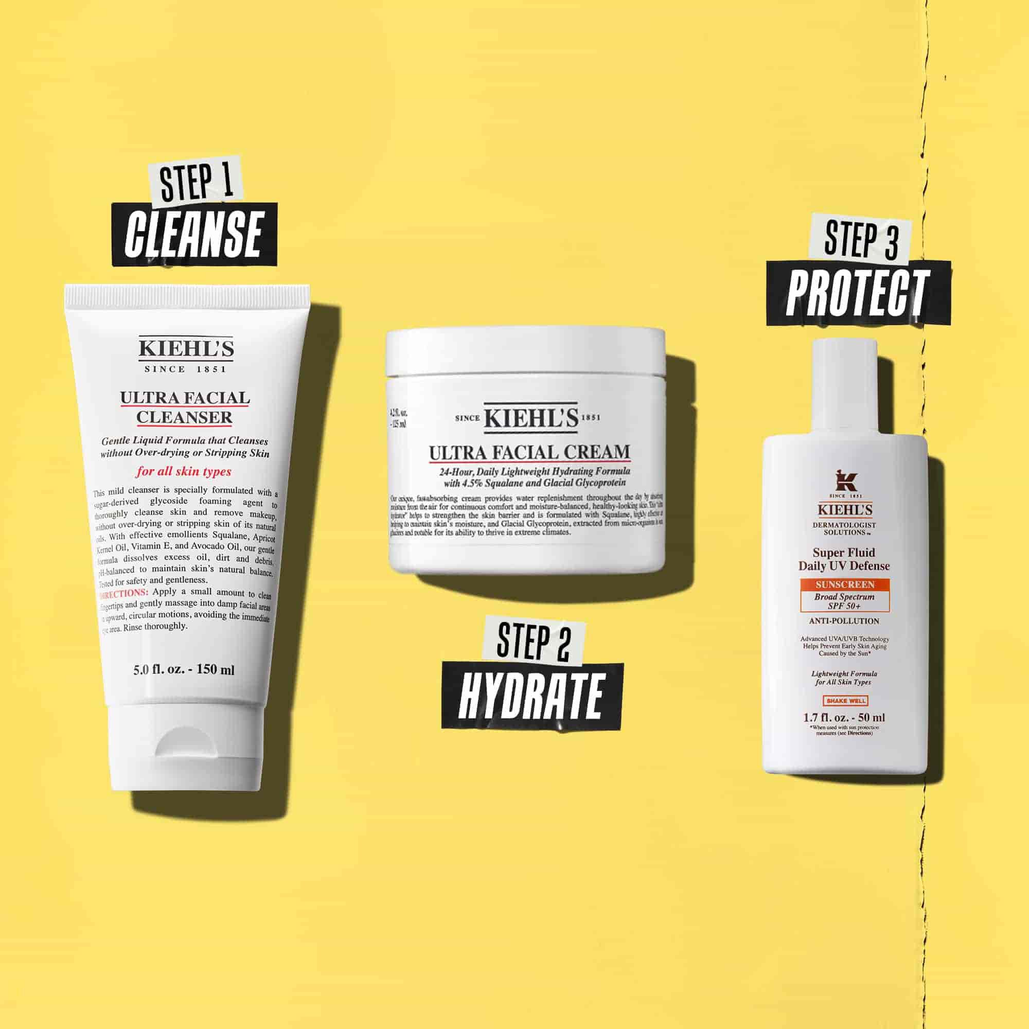 Three Kiehl's products representing a routine. From left to right: cleanser, moisturizer, and sunscreen.