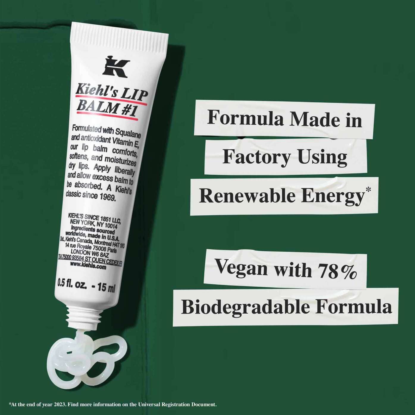 A tube of Lip Balm #1 with text highlighting sustainability claims: "Formula Made in Factory Using Renewable Energy" and "Vegan with 78% Biodegradable Formula."